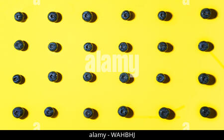 Fresh blueberry on yellow background. Stock Photo