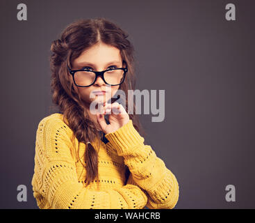 Happy schoolgirl in eyeglasses looking at camera Stock Photo - Alamy