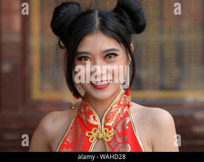 Young Thai Chinese Beauty with Red and Gold Cheongsam