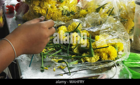 florist makes a wreath at sri maha mariamman temple in bangkok