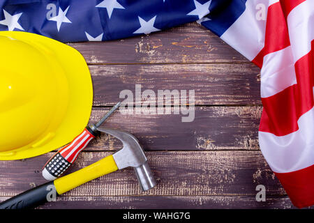 Labor day USA concept, Set of various tools on wooden background with flag USA. Copy space for text. Stock Photo