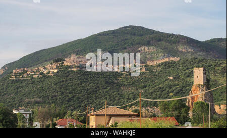 Small old medieval hill town Sermoneta with Caetani Castle on top and Torre Normanna Tower in the foothills of Carbolino mountains on the right side. Stock Photo