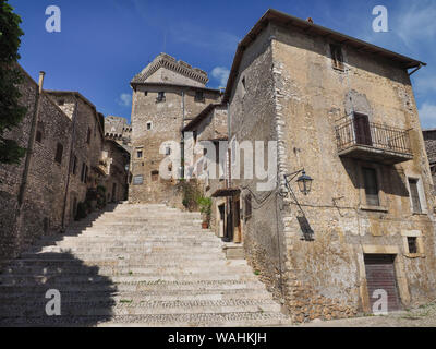 Beautiful Sermoneta town center with a wide stairs and old medieval houses with the view of famous Caetani Castle Tower on top. Latina, Lazio, Italy. Stock Photo