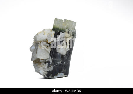 Green Tourmaline specimen with quartz isolated on white background, locality Afghanistan. Stock Photo