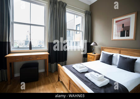 Contemporary bedroom in an apartment near St. Giles Cathedral in Old Towne, Edinburgh, Scotland, UK, Europe Stock Photo