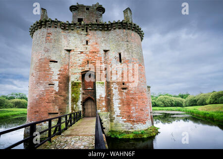 Caerlaverock Castle front view of the moated triangular fortified castle built in the 13th century in southern Scotland, and abandoned in the 17th c Stock Photo
