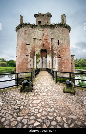 Entrace to Caerlaverock Castle, front view of the moated triangular fortified castle built in the 13th century in southern Scotland, and abandoned in Stock Photo