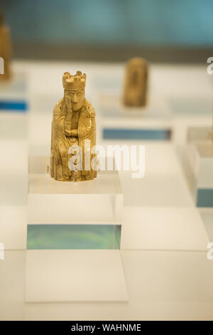 Queen chess piece. These authentic chess pieces carved from walrus ivory that drifted from a shipwreck at sea were discovered in 1831 half-buried in t Stock Photo