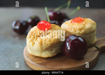 Homemade classic scone with fresh cherries Stock Photo