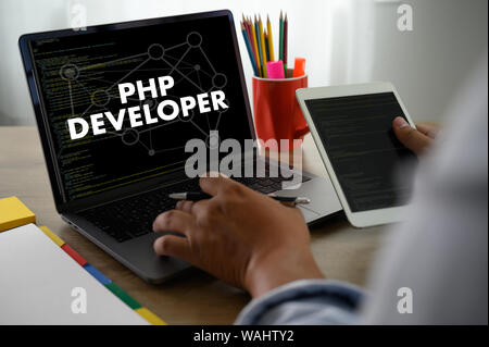 PHP DEVELOPER man touch bar search and Two Businessman working at office desk and using a digital touch screen tablet and use computer, top view Stock Photo
