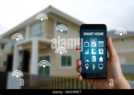 man use mobile phone with smart home app Smart home augmented reality (AR) internet of things (IOT) Stock Photo