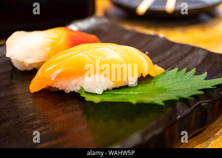 Japan traditional fresh cold salmon sushi and roll Stock Photo - Alamy