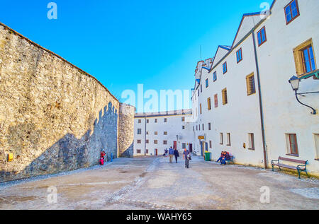 SALZBURG, AUSTRIA - FEBRUARY 27, 2019: The medieval Hohensalzburg Fortress with surrounding buildings of various purposes and walls of the main castle