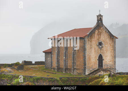 Santa Catalina chapel foggy day in Mundaca village. Euskadi, Spain Stock Photo