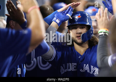 Bo Bichette of the Toronto Blue Jays runs to the dugout after