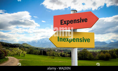 Street Sign the Direction Way to Inexpensive versus Expensive Stock Photo