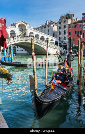 The Rialto Bridge (Ponte di Rialto) over the Grand Canal, with gondolas in the foreground.  From the Riva del Vin, Venice, Italy Stock Photo