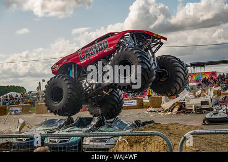 The Lambo Monster Truck Airborne Whilst Jumping Clean Over A Stack Of Scrap Cars During A Demonstration At A Monster Truck Show Stock Photo Alamy