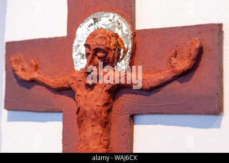 A relief sculpture of Jesus Christ on the cross out of modelling clay by Lubo Michalko. Displayed in the Quo Vadis Catholic House. Stock Photo