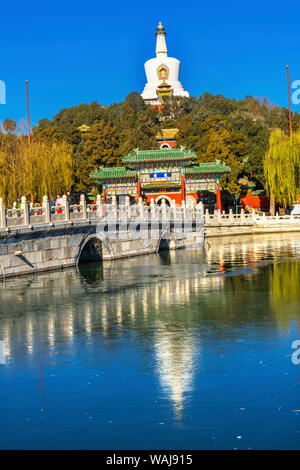 Yongan Bridge, White Stupa, Dagoba Gate, Jade Flower Island, Beijing, China. Beihai Park created 1000 AD. Stupa built in 1600's. Stock Photo