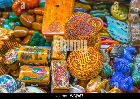Old colorful Chinese ceramic souvenirs. Snuff boxes, Panjuan Flea Market, Beijing, China. Panjuan Flea Curio market has many fakes, replicas and copies of Chinese products. Stock Photo