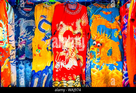 Blue, red and yellow Chinese dragon replica. Silk robes, Panjuan Flea Market decorations, Beijing, China. Panjuan Flea Curio market has many fakes, replicas and copies of Chinese products. Stock Photo