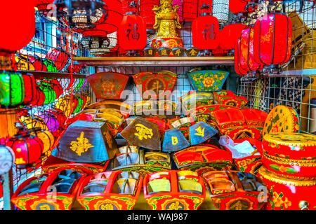 Colorful blue, red and green Chinese paper lantern boxes, Panjuan Flea Market, Beijing, China. Panjuan Flea Curio market has many fakes, replicas and copies of Chinese products. One Chinese character says luck. Stock Photo