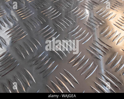 Metal stainless steel sheet with notches. Silver colored metal. Stock Photo