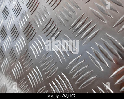 Metal stainless steel sheet with notches. Silver colored metal. Stock Photo