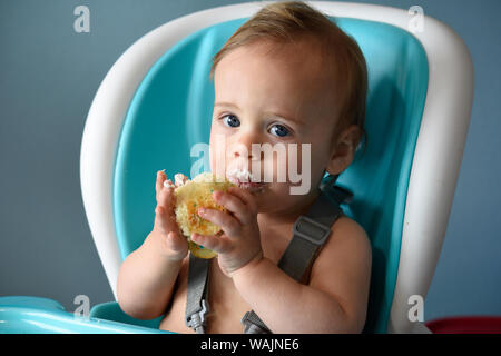 1 year old boy eating birthday cupcake (MR) Stock Photo