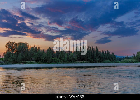 Sunset clouds over the Flathead River in Columbia Falls, Montana, USA Stock Photo