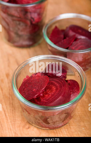 Jars of hot sliced beets in jars prior to canning. This is called 'hot packing' Stock Photo