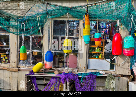 Old building, Netarts, Oregon. Decorated with colorful fishing gear. Stock Photo