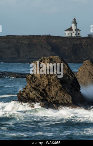 Winter storm watching, Cape Arago Lighthouse from Shore Acres State Park, Southern Oregon Coast, USA Stock Photo