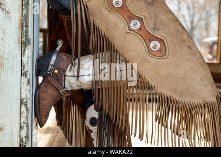 A Cowboy And His Horse By A Log Cabin Stock Photo 52709674 Alamy