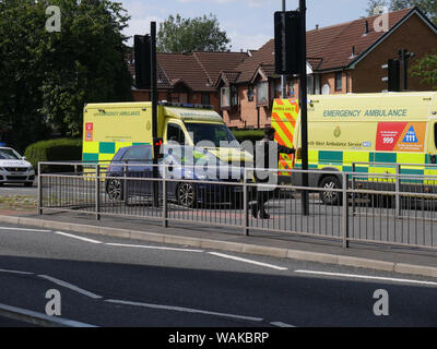 Ambulances at an accident scene on a pedestrian crossing on a dual carriageway, Topp Way, Bolton, Lancashire, England UK. photo DON TONGE