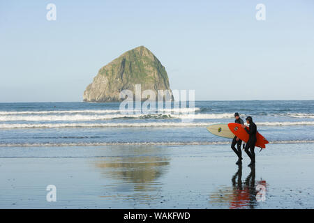 Surfers, Haystack Rock, Cape Kiwanda State Park, Oregon Coast, USA, Late Spring (Editorial Use Only) Stock Photo