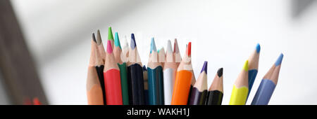 Bunch of various pencils stand in holder Stock Photo