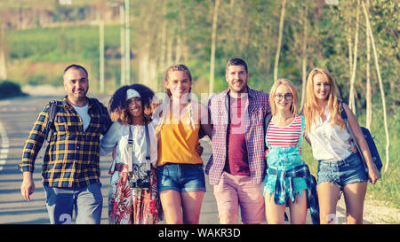 Group of happy multiracial friends having fun together bonding outdoors Stock Photo