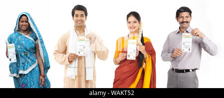Indian people showing their Aadhar cards Stock Photo