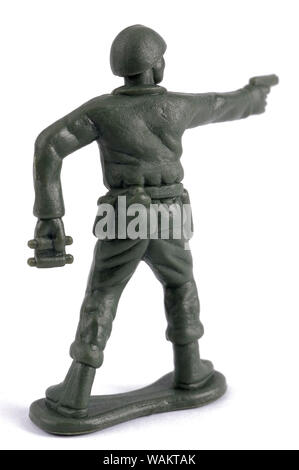 A toy soldier with his back to us on a white background Stock Photo