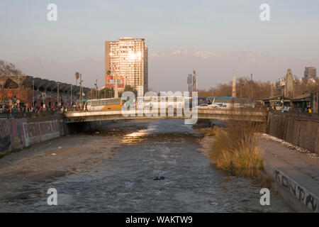 Pedestrians and traffic on bridge over the Mapocho river in Santiago, Chile Stock Photo