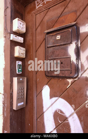 Cracow. Krakow. Poland. Mailbox, doorbells and intercom on the door to one of old apartment houses in the Old City. Stock Photo