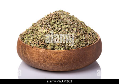 Dried thyme leaves in a wooden bowl, perfect for seasoning and enhancing flavor in various dishes Stock Photo