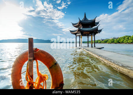 chinese ancient pavilion on the west lake in hangzhou.Translation:'Gathering the saint's pavilion' Stock Photo