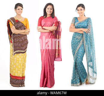 Three young woman standing together in sari Stock Photo