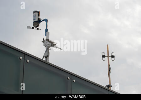 A professional standard, remote controlled remote weather station mounted on a roof line at Sydney's Barangaroo Reserve Stock Photo