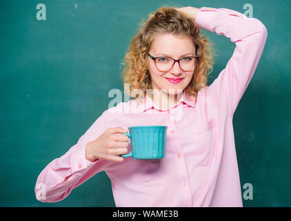 Morning inspiration. energy and vigor. energy charge. idea and inspiration. school teacher need coffee break. woman with coffee cup at blackboard. good morning. girl refreshing with tea drink. Stock Photo