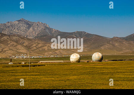 Radar Station and Horses on the Silk Road near Kektyube, Kyrgyzstan Stock Photo