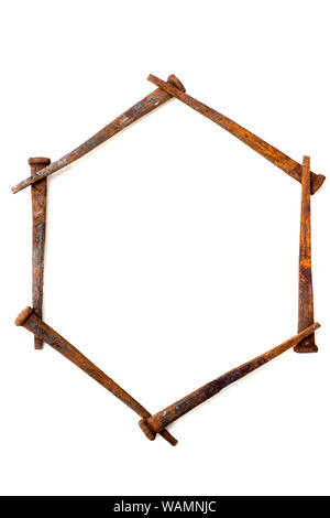 Backgrounds - Antique rusty square nails used as design elements, isolated on white background Stock Photo
